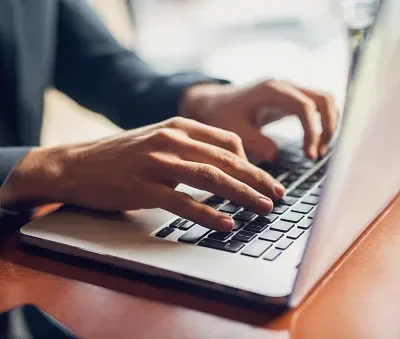 close up of a hands of a businessman on a keyboard