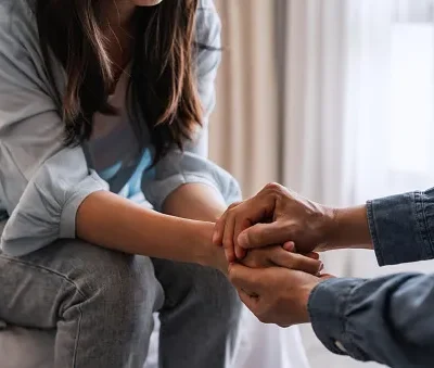 young man comforting and supporting a sad woman who is in serious trouble at home consolation